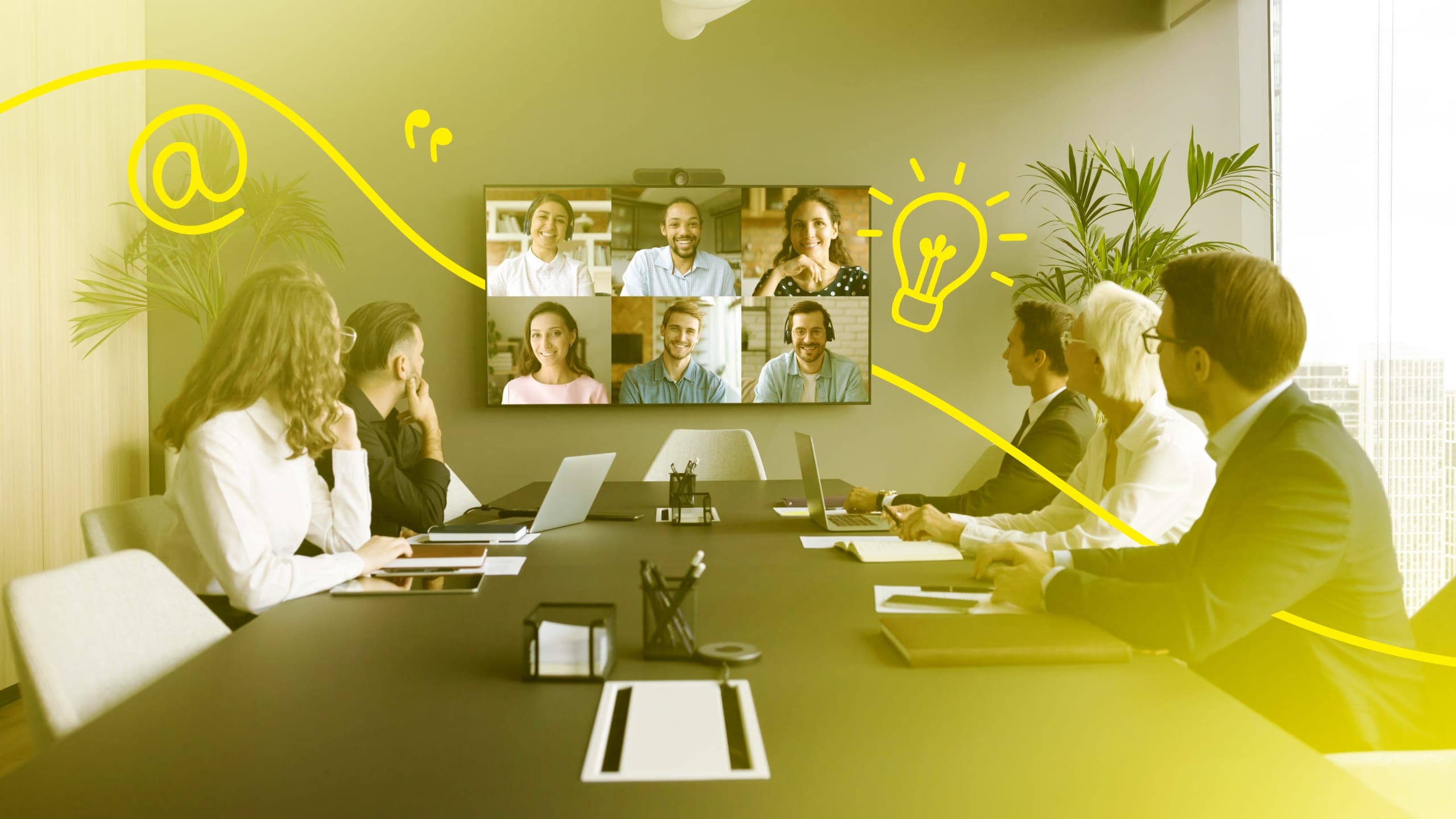 People at a board desk on a video call